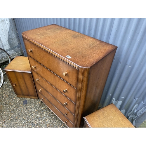 261 - An early 20th century oak tallboy chest together with pair of matching bedsides