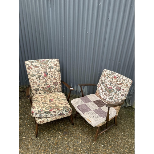 262 - A ladies and gents pair of dark ercol elbow chairs