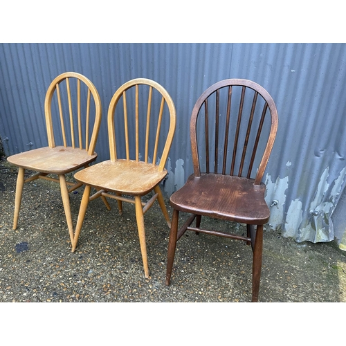 264 - Three ercol stick back chairs