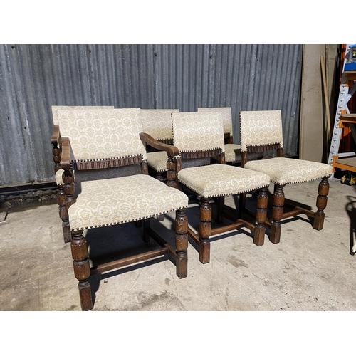 27 - A set of six early 20th century oak dining chairs with beige pattern upholstery