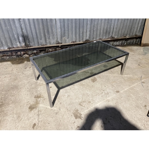 28 - A mid century chrome coffee table with smoked glass top 122x50x40