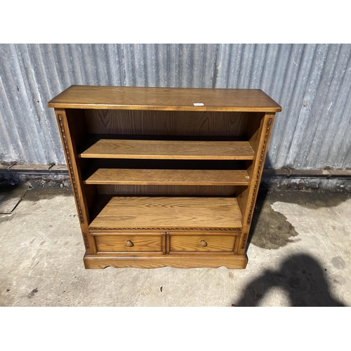 36 - An ercol golden dawn bookcase with two drawers