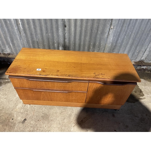 37 - A compact teak sideboard / record cabinet