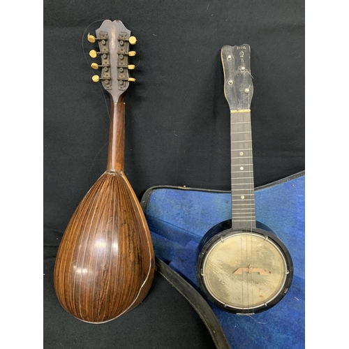 475 - Mandolin and small cased banjo (mandolin has slip to rear, see photo)