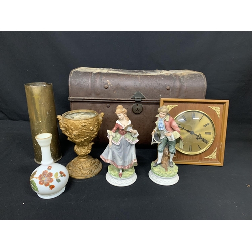 476 - Tin trunk, clock, ornaments, metal lamp base and brass shell case