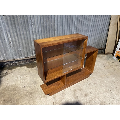 58 - A deco style glazed bookcase of unusual shape 130x27x110