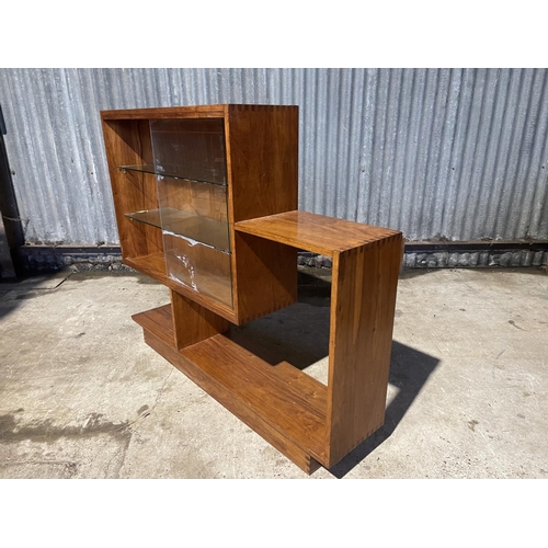 58 - A deco style glazed bookcase of unusual shape 130x27x110