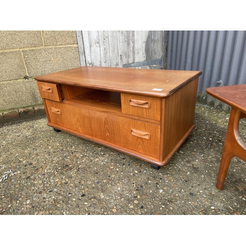 6 - A mid century teak media stand together with a teak coffee table