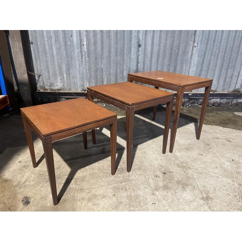 61 - A mid century teak nest of three tables