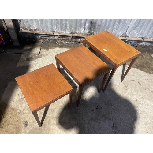 61 - A mid century teak nest of three tables