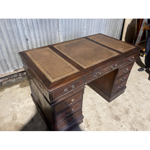 64 - A reproduction mahogany twin pedestal desk with a three section leather top 138x77 x 80