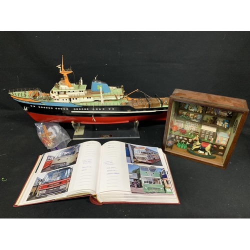 644 - Model ship, cased playroom and bus photograph album