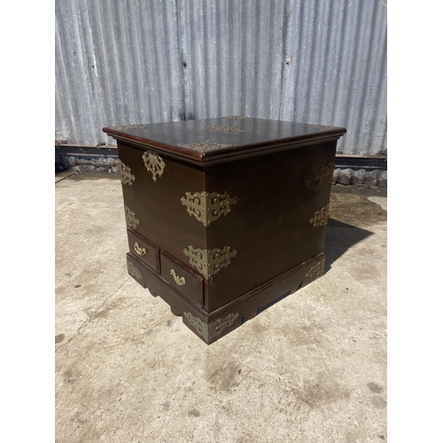 65 - An Indian style hardwood storage box with brass mounts 50x54x50