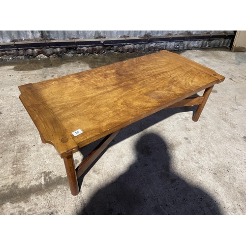 66 - An unusual coffee table with cross over stretcher 120x46x42