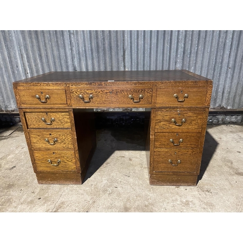 67 - An early 20th century twin pedestal desk with brown leather top  122x60x80