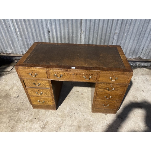 67 - An early 20th century twin pedestal desk with brown leather top  122x60x80