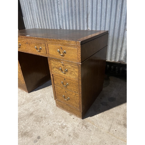 67 - An early 20th century twin pedestal desk with brown leather top  122x60x80