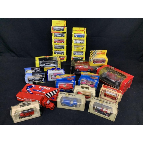 679 - Twenty five boxed Die cast model vehicles including two Burago