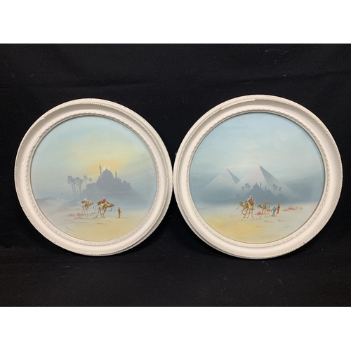 683 - Furness Wilson - two circular mounted gouache, figures on camels in desert, each 49 cms diameter ove... 