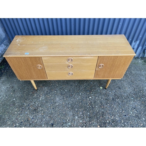 7 - A mid century light oak sideboard