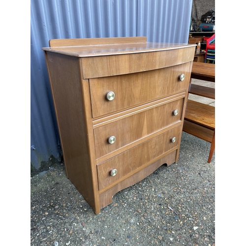 76 - A retro chest of drawers together with two teak side tables