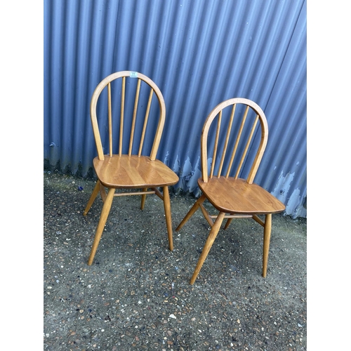 77 - A pair of ercol elm kitchen chairs