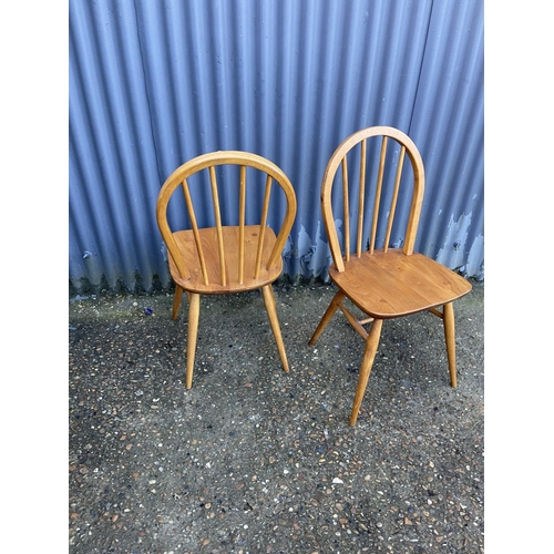 77 - A pair of ercol elm kitchen chairs