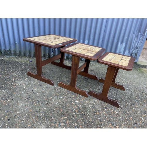 78 - A g plan tile top teak nest of three tables