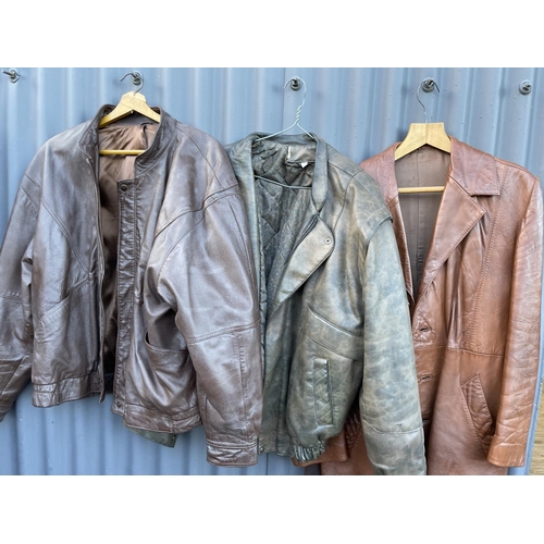 79 - A crombie jacket together with three leather jackets