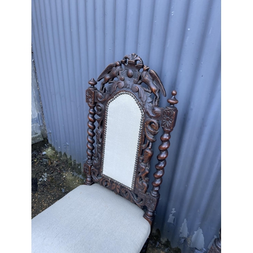 91 - A pair of carved oak chairs, together with a vintage case