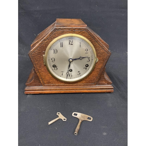 939 - Oak chiming mantel clock with key and Pendulum