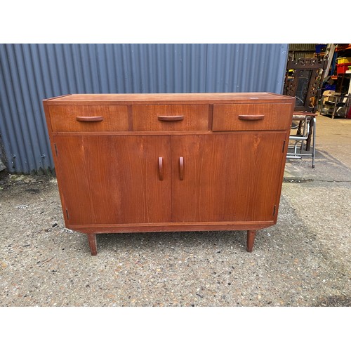 17 - A mid century  teak three drawer sideboard 122x39x90