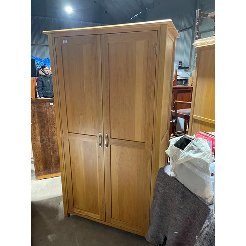 151 - A modern light oak double wardrobe 104x 56x 190