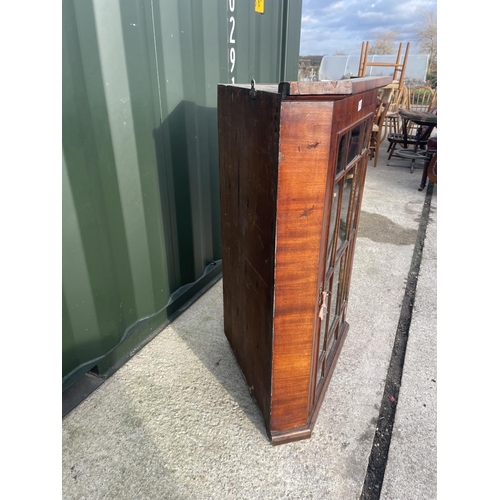 313 - A Georgian mahogany glazed wall hanging corner cabinet