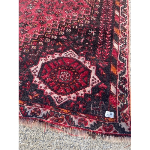 316 - A large red oriental pattern rug 305x 215