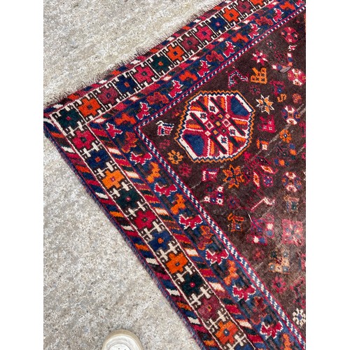 317 - A large red and blue oriental pattern carpet 205x275