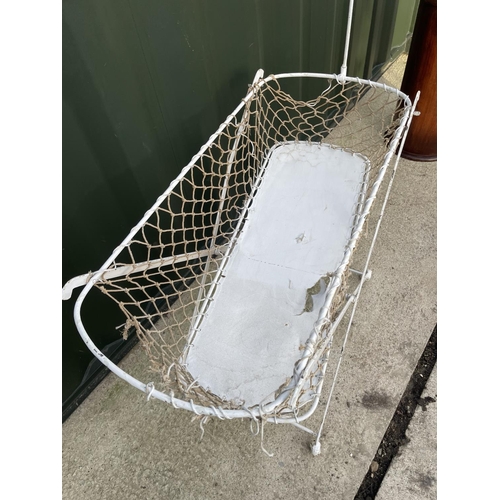 318 - A vintage white painted metal framed folding crib