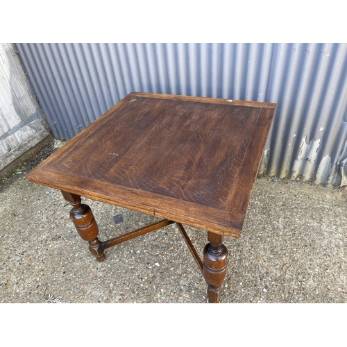 12 - An oak drawer leaf dining table 91x91x75