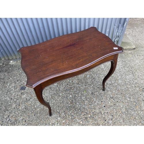 144 - A Victorian mahogany serpentine shaped table with drawer 97x 60 x80