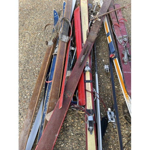 146 - A collection of vintage skis and poles