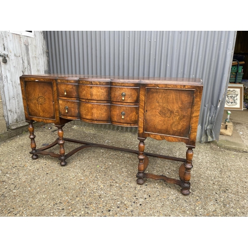 151 - An early 20th century walnut two drawer serving table / sideboard 168x58x90