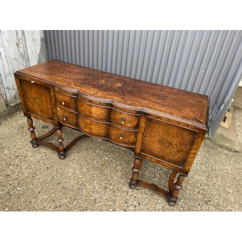 151 - An early 20th century walnut two drawer serving table / sideboard 168x58x90