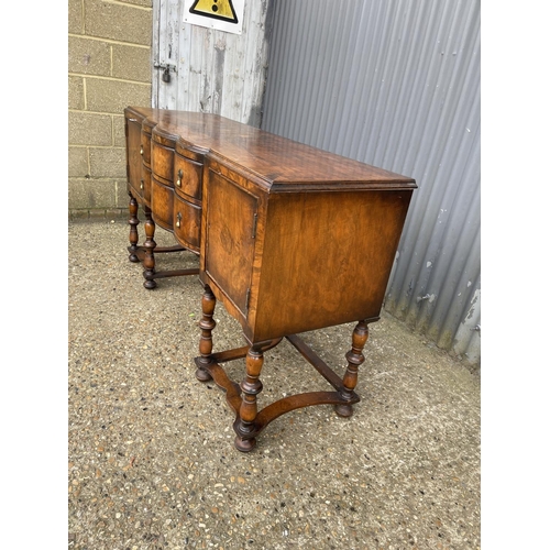 151 - An early 20th century walnut two drawer serving table / sideboard 168x58x90