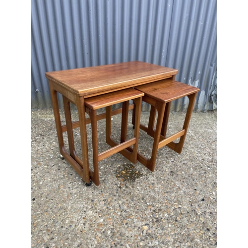 161 - A mcintosh teak of three tables with fold over top