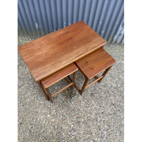 161 - A mcintosh teak of three tables with fold over top