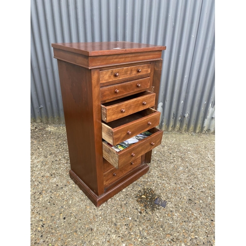 165 - A reproduction mahogany wellington chest 56 x 40x104