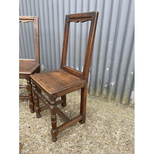 166 - A pair early french oak chairs