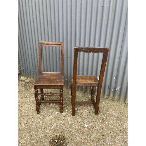 166 - A pair early french oak chairs