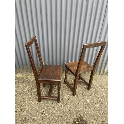 166 - A pair early french oak chairs