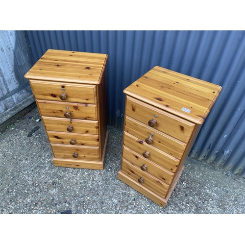 173 - A pair of pine tallboy chests of five drawers